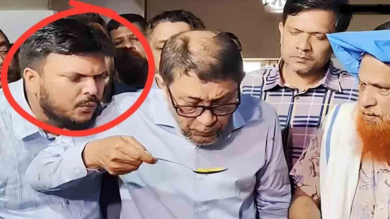 স্বাস্থ্যমন্ত্রীর চামচে ফুঁ দিয়ে ভাইরাল লাল বৃত্তের ব্যক্তি